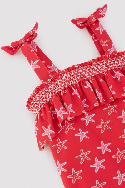 YSABEL MORA COSTUME Costume da bagno da bambina con volant stampato a stelle marine 95141